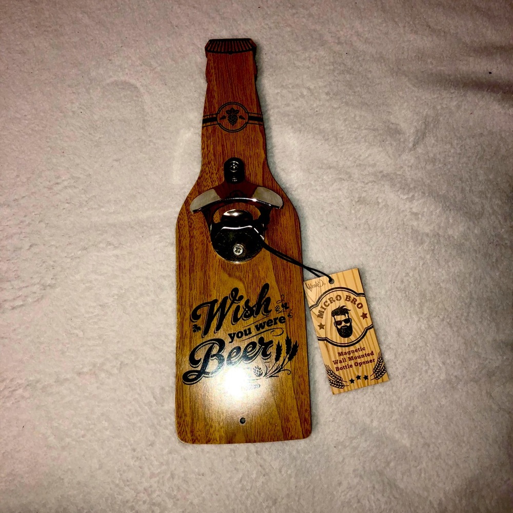Magnetic wall mounted bottle opener